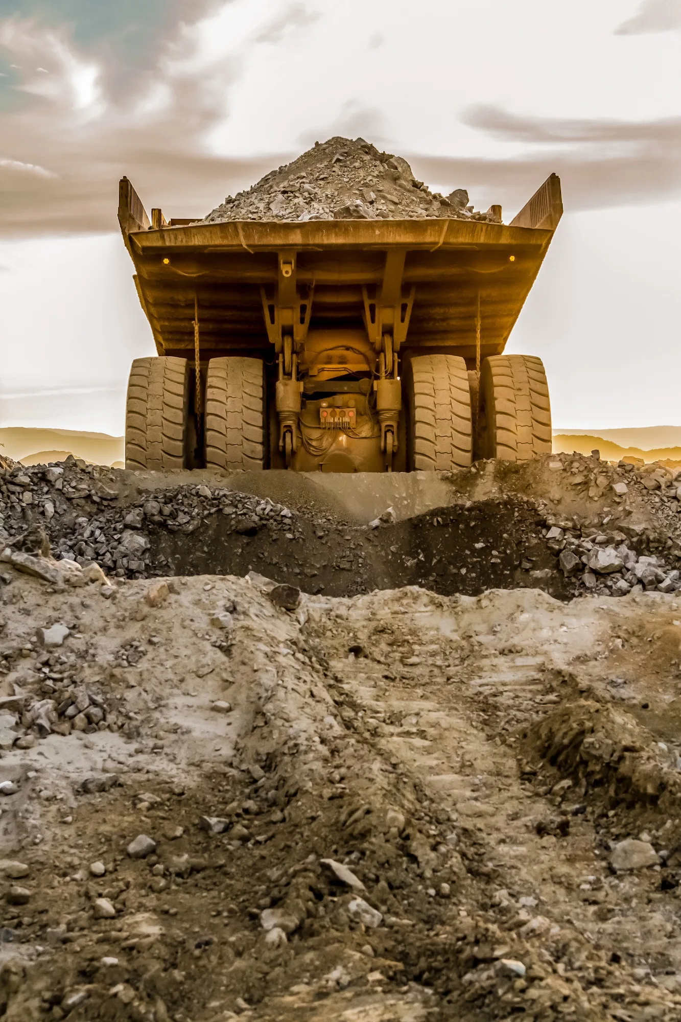 Mining dump trucks transporting Platinum ore for processing